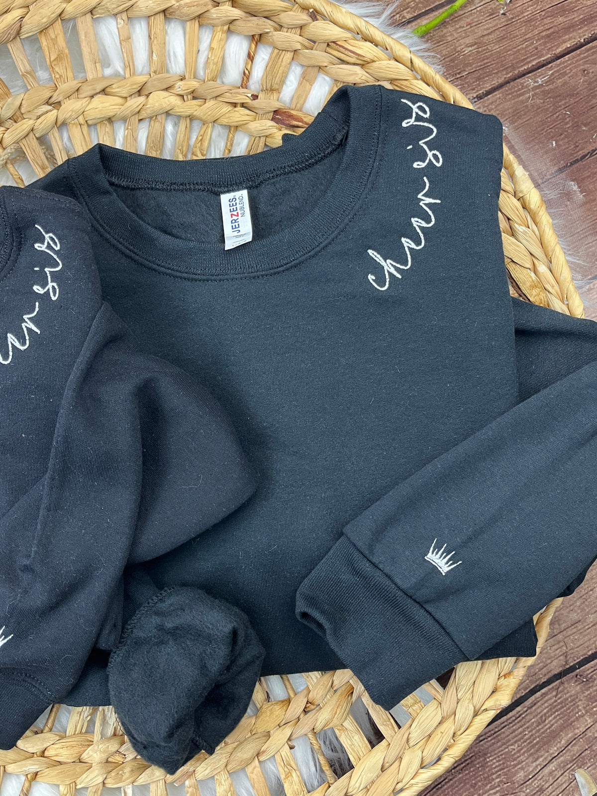 Custom sweatshirt with cursive name embroidery along the collar - detail view 2