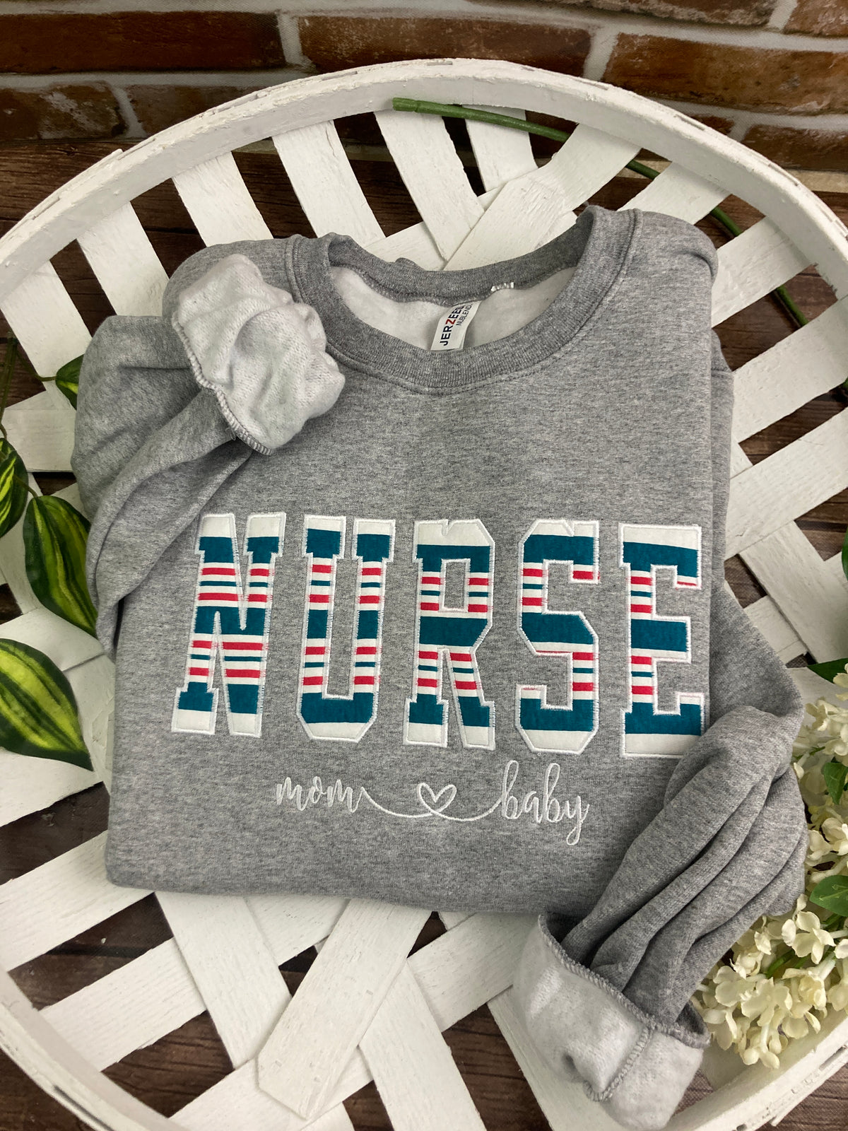 Nurse keepsake sweatshirt appliqued from a baby hospital swaddle blanket