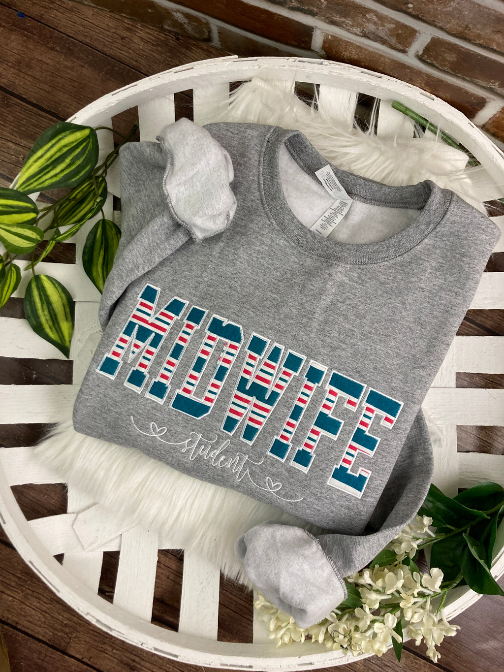 Midwife keepsake sweatshirt appliqued from a baby hospital blanket - detail view