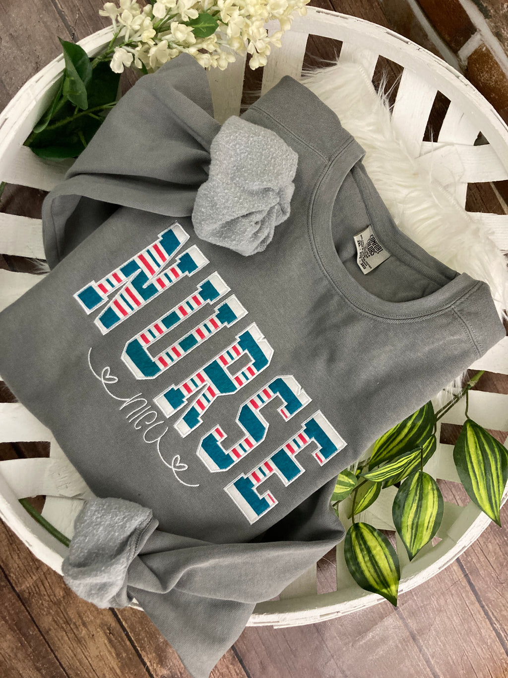 Nurse keepsake sweatshirt appliqued from a baby hospital swaddle blanket - fabric detail