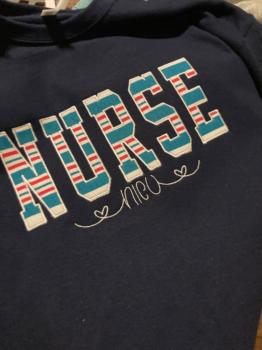 Bulk order nurse keepsake sweatshirts appliqued from hospital blankets - gallery image