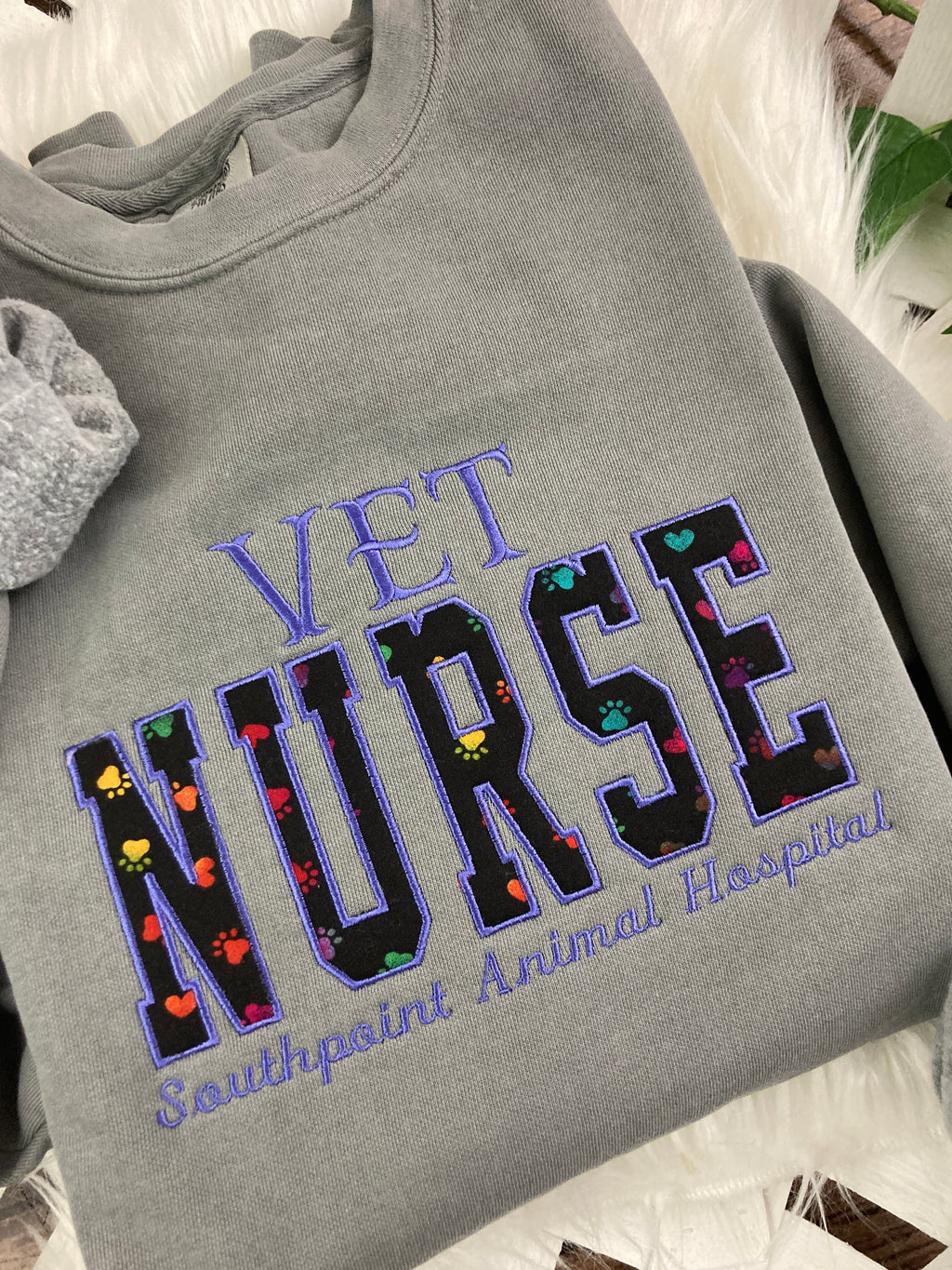Vet nurse embroidered sweatshirt with rainbow paw print applique - detail view