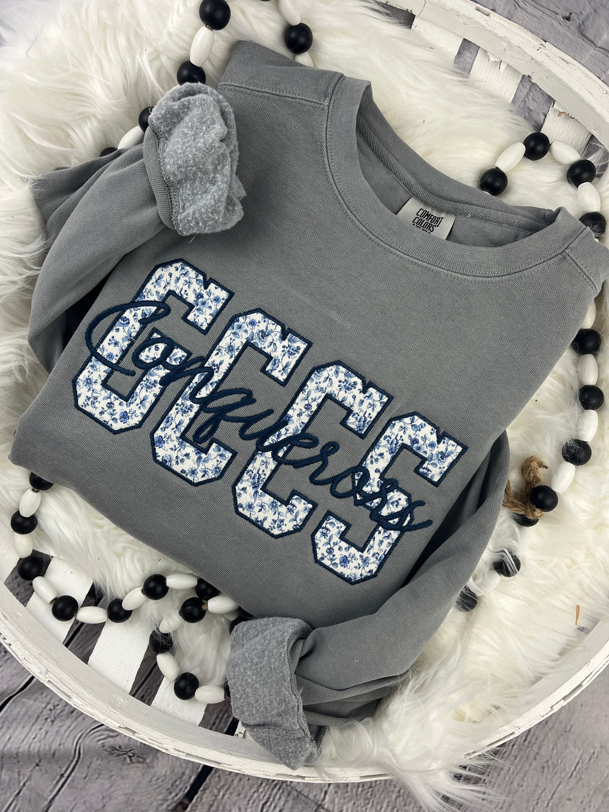 School spirit sweatshirt with floral blue applique and cursive script