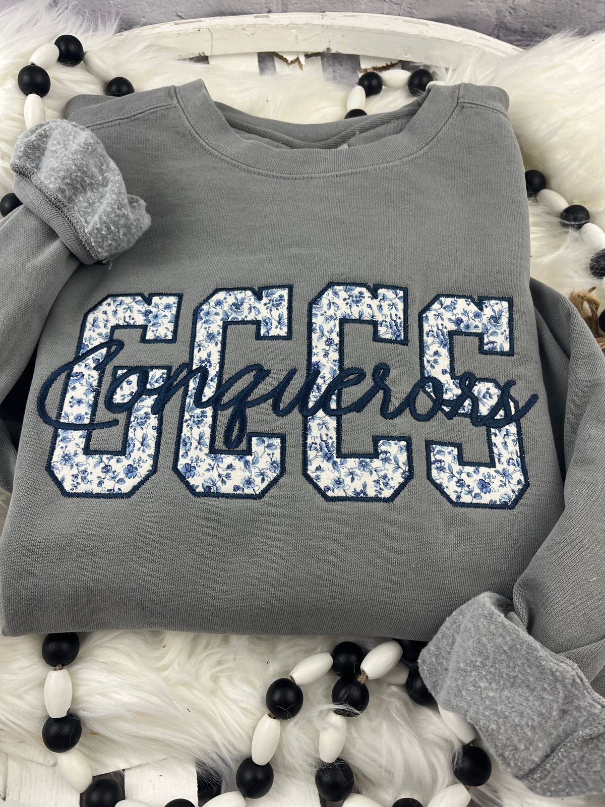 School spirit sweatshirt with floral blue applique and cursive script - detail view 3
