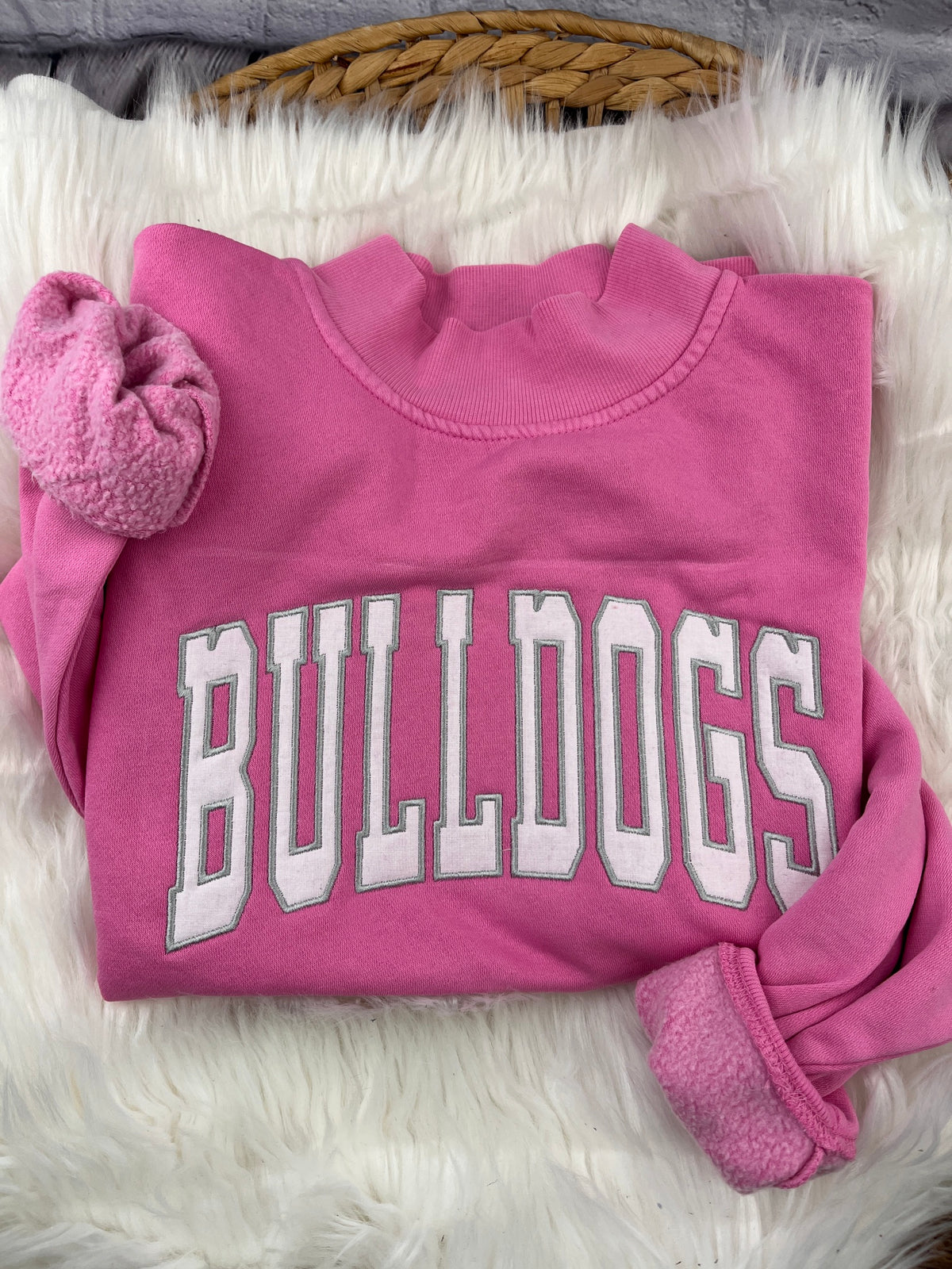Pink mock neck sweatshirt with white BULLDOGS applique letters