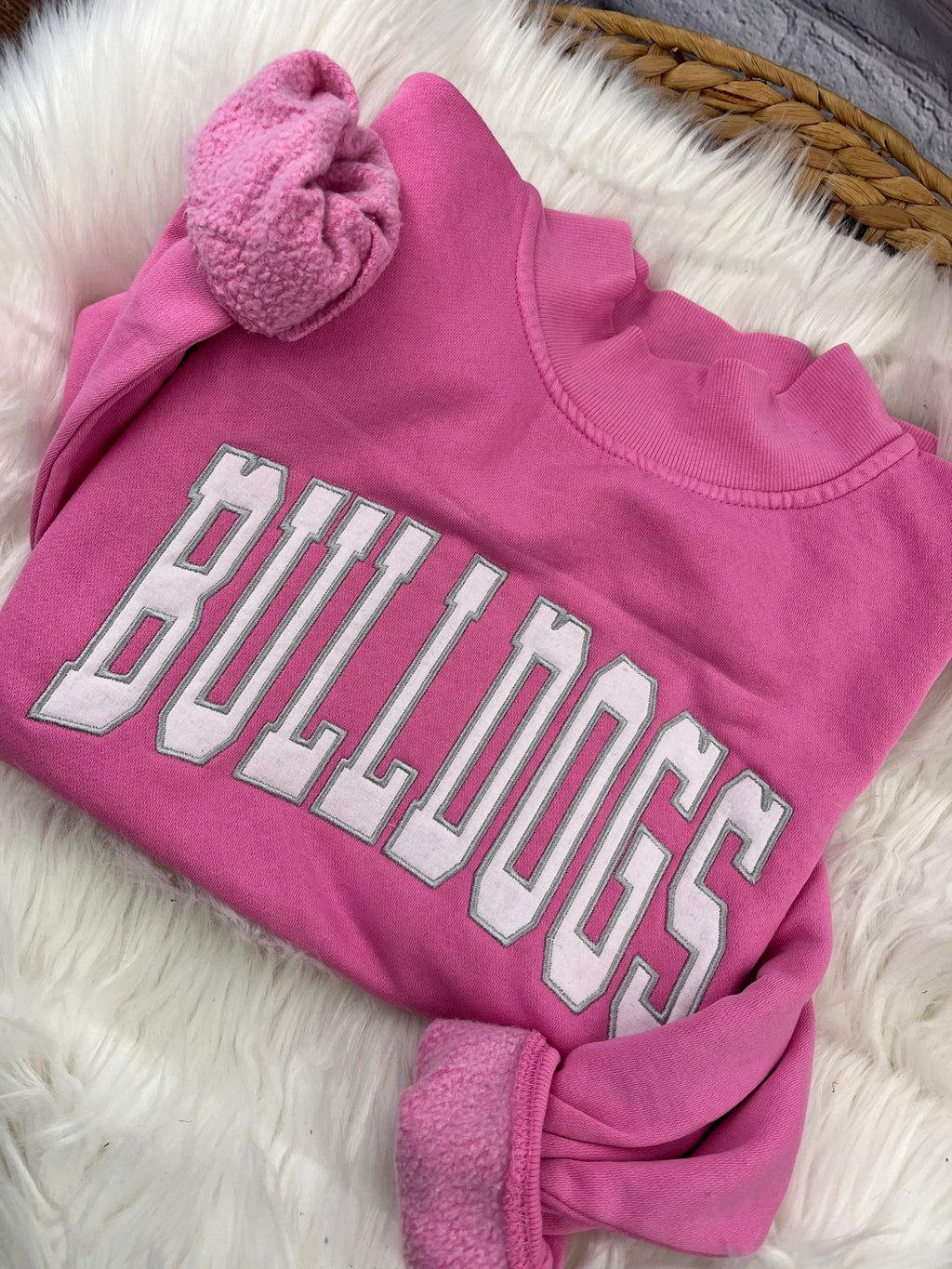 Pink mock neck sweatshirt with white BULLDOGS applique letters