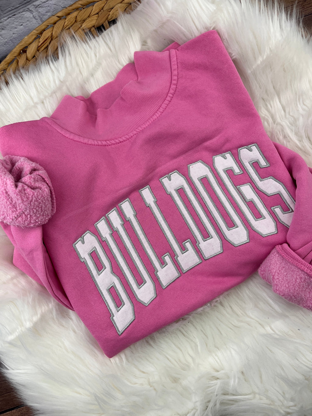 Pink mock neck sweatshirt with white BULLDOGS applique letters