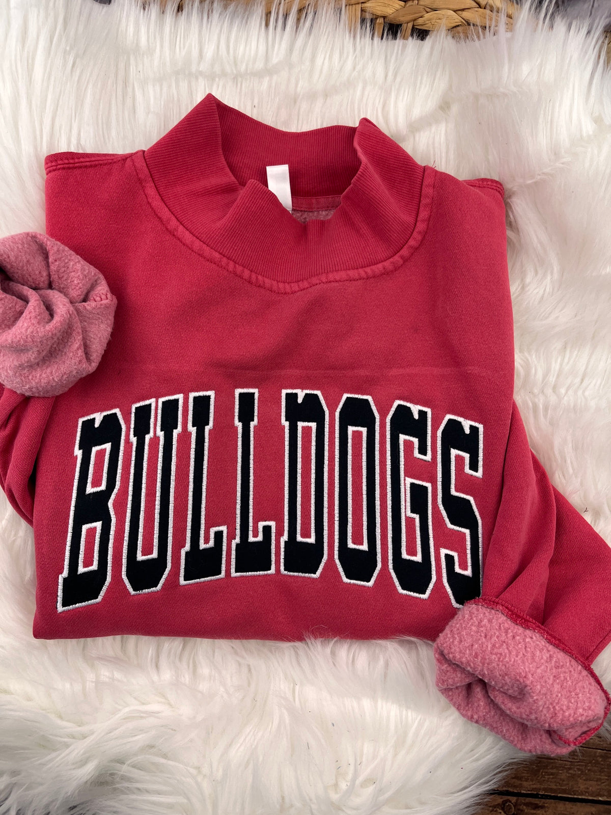 Red mock neck sweatshirt with black BULLDOGS applique letters