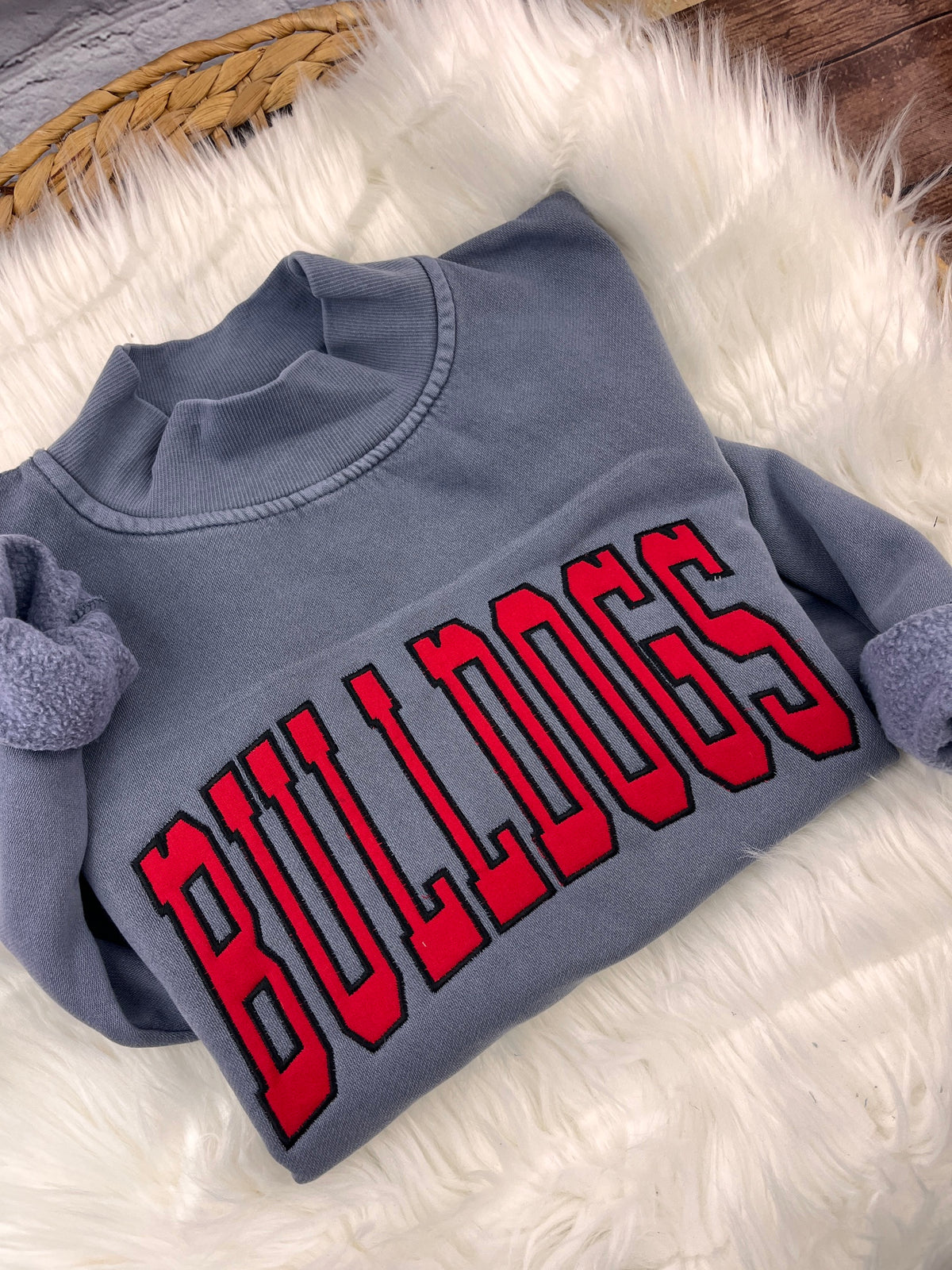 Slate blue mock neck sweatshirt with red BULLDOGS applique letters