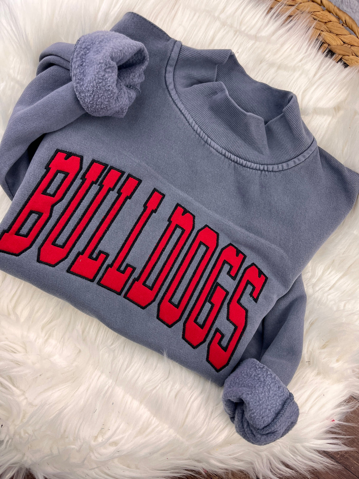 Slate blue mock neck sweatshirt with red BULLDOGS applique letters