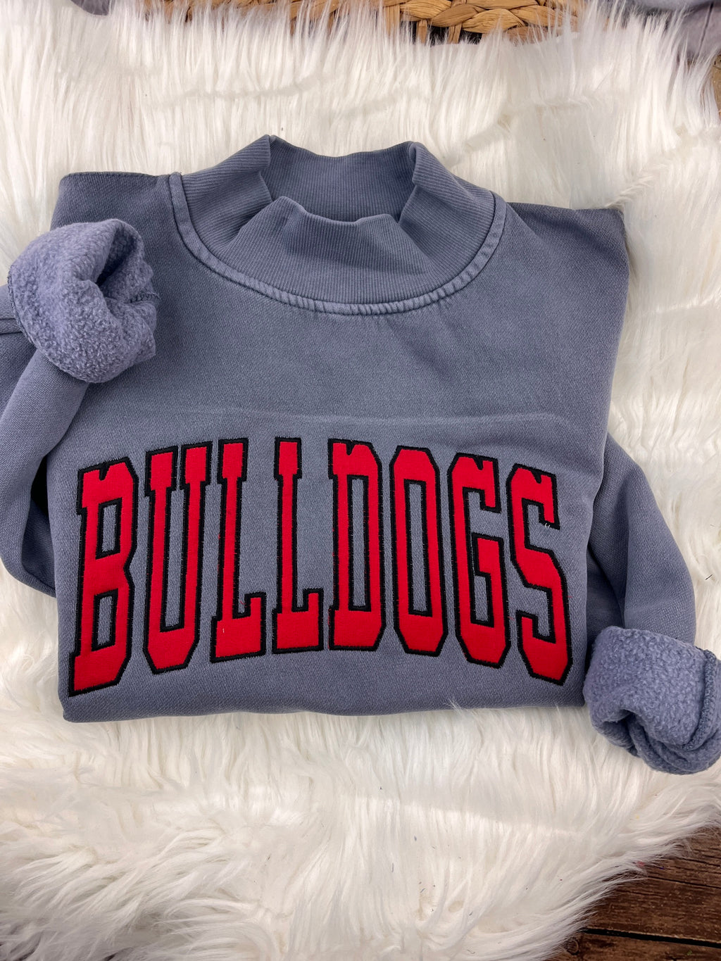 Slate blue mock neck sweatshirt with red BULLDOGS applique letters