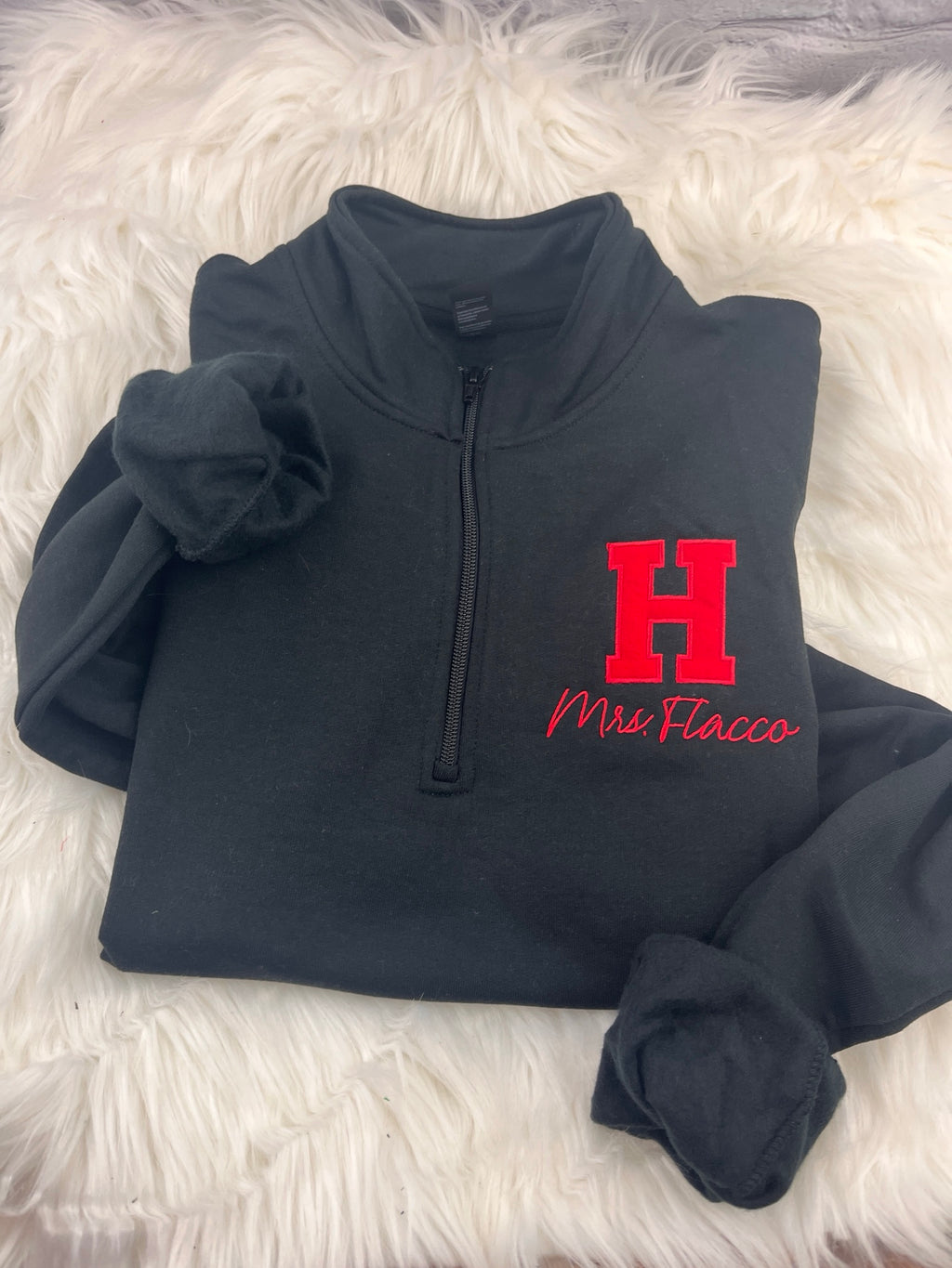 Applique H quarter-zip with teacher name, front view