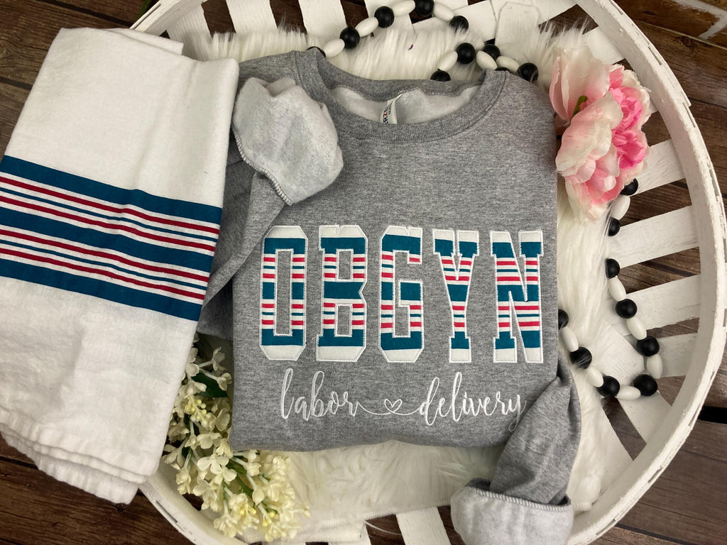 OBGYN keepsake sweatshirt appliqued from a baby hospital swaddle blanket