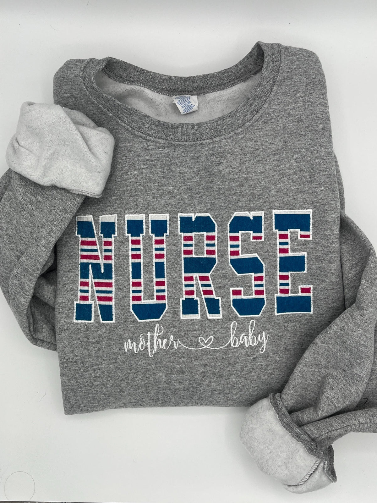 Nurse mom keepsake sweatshirt appliqued from a baby hospital swaddle blanket - detail view