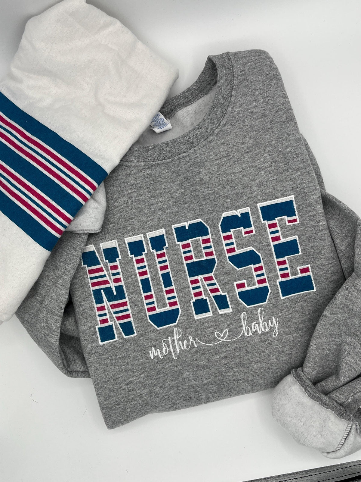 Nurse mom keepsake sweatshirt appliqued from a baby hospital swaddle blanket