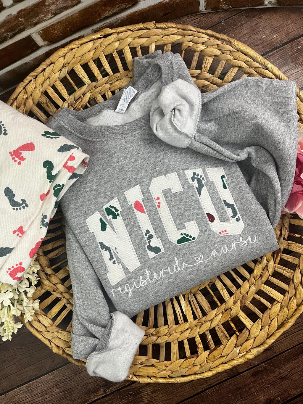 Curved NICU nurse embroidered sweatshirt made from a baby hospital blanket - detail view