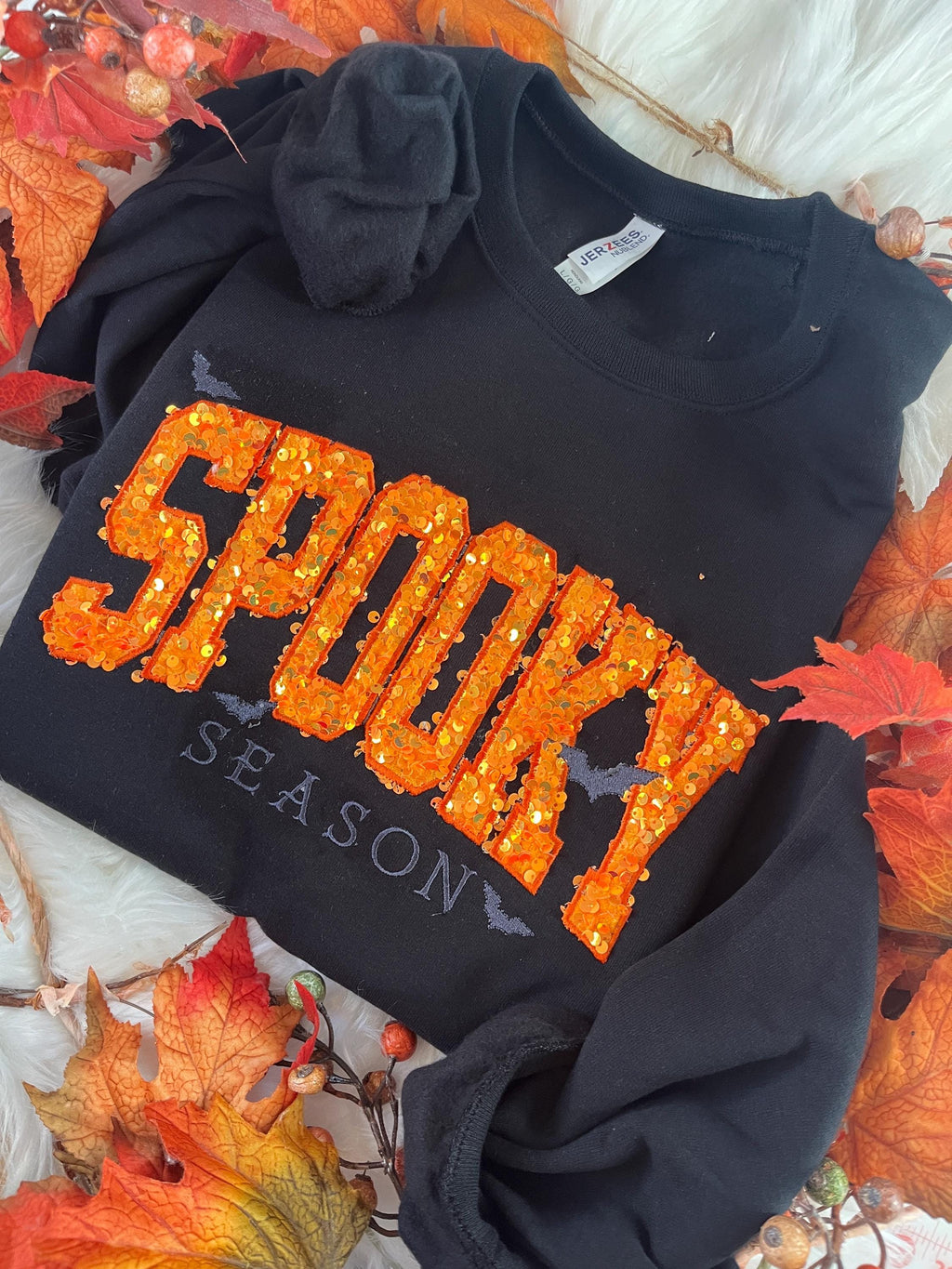 Halloween crewneck sweatshirt with orange sequin SPOOKY applique and embroidered bats